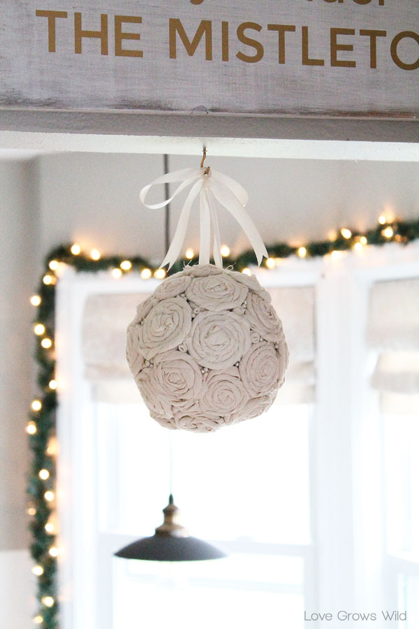 Steal some smooches underneath this beautiful DIY Fabric Rosette Mistletoe Ball!
