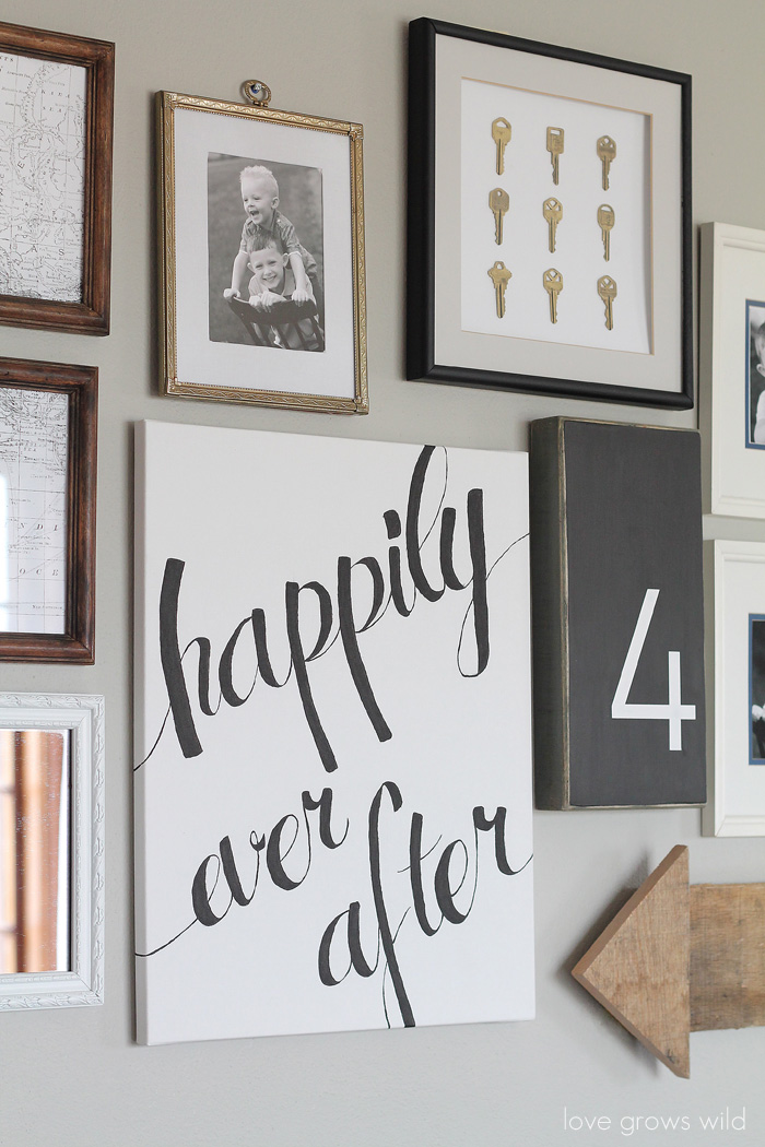 Learn how to create a fun, personal, and creative Gallery Wall for LESS THAN $20! Yes, you CAN decorate an entire wall for that cheap! Get all the best tips and tricks from LoveGrowsWild.com