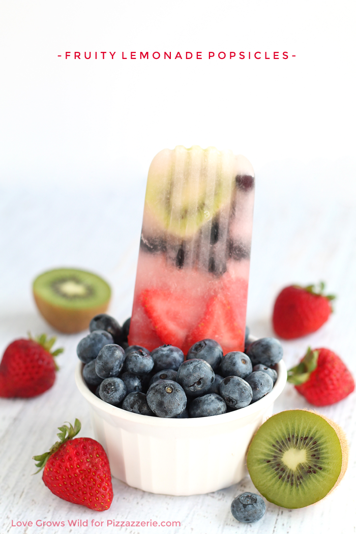 Fruity Lemonade Popsicles - these colorful treats are layered with fresh fruit and made with only 2 ingredients!