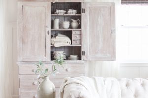 See how this small farmhouse living room transformed and evolved over the years from dark and dated to light, bright and beautiful!
