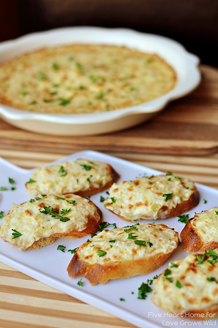 This delicious Artichoke Bruschetta is a great easy appetizer! Cheesy artichoke dip is spread on baguette slices and broiled until golden and bubbly for an appetizer that’s fancy yet no-fuss.