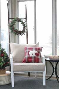 A warm and cozy rustic porch decorated for the holidays!