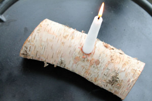 Cut a birch branch in half and drill a hole for a candle - perfect rustic decor!