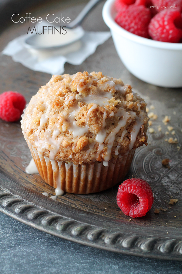 Coffee cake turned into a muffin! These Coffee Cake Muffins have a yummy fruity filling, crunchy cinnamon-walnut topping, and sweet vanilla glaze that makes them utterly delicious!