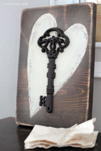 Add a touch of romance to your home with this Key to my Heart Rustic Wood Sign! Find the tutorial at LoveGrowsWild.com
