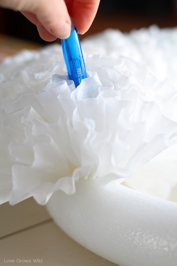 How to make a beautiful, ruffled Coffee Filter Wreath for easy and inexpensive home decor! Find the tutorial at LoveGrowsWild.com