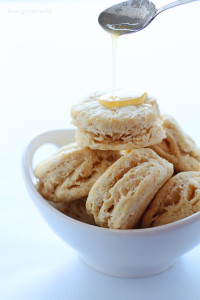 Tender, flaky biscuits made with coconut oil and topped with sweet honey butter! | LoveGrowsWild.com