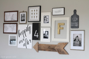 Learn how to create a fun, personal, and creative Gallery Wall for LESS THAN $20! Yes, you CAN decorate an entire wall for that cheap! Get all the best tips and tricks from LoveGrowsWild.com