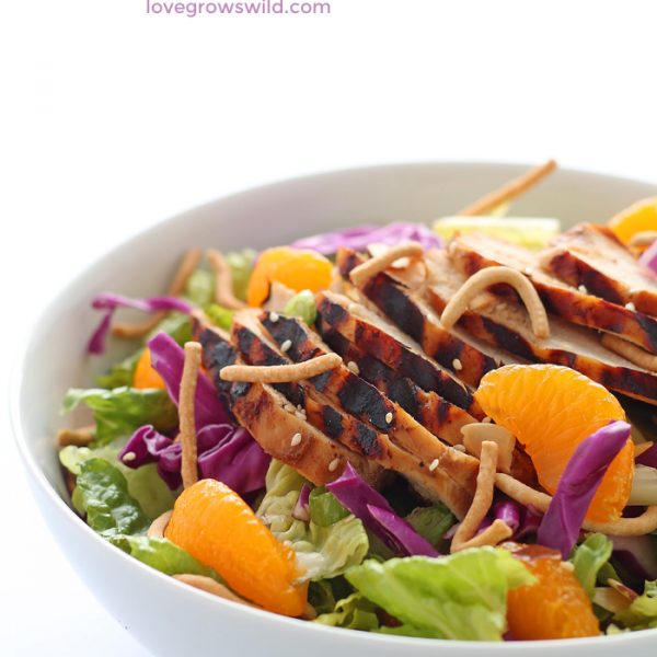 A fresh, flavorful Asian Chicken Salad with tender grilled chicken slices, juicy mandarin oranges, and a delicious sesame dressing! | LoveGrowsWild.com