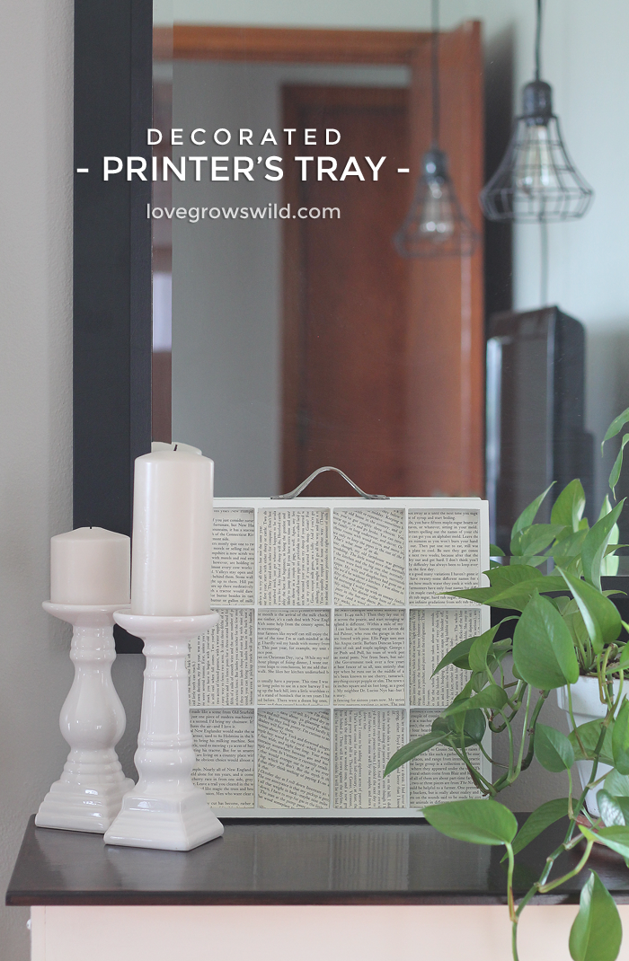 A simple printer's tray lined with old book pages makes a beautiful piece of decor! | LoveGrowsWild.com