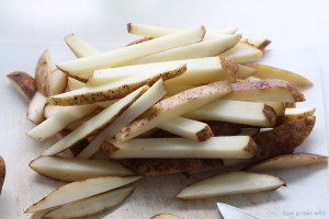 These Oven Baked Steak Fries are thick, crispy, and ready for dipping! Much healthier than fried and SO addicting! | LoveGrowsWild.com