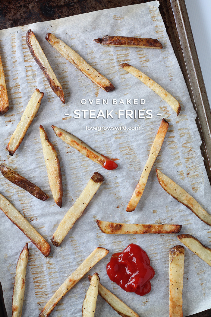 These Oven Baked Steak Fries are thick, crispy, and ready for dipping! Much healthier than fried and SO addicting! | LoveGrowsWild.com