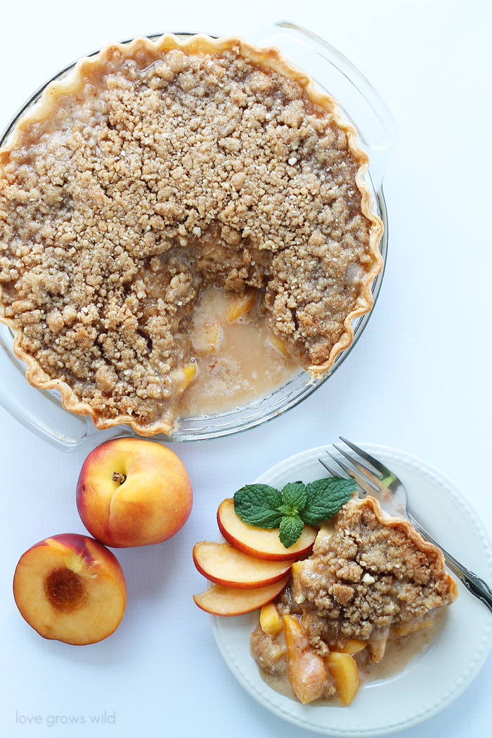 Enjoy the best flavors of summer with this perfect Peach Pie recipe topped with a delicious almond crumble! | LoveGrowsWild.com