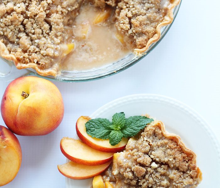 Enjoy the best flavors of summer with this perfect Peach Pie recipe topped with a delicious almond crumble! | LoveGrowsWild.com