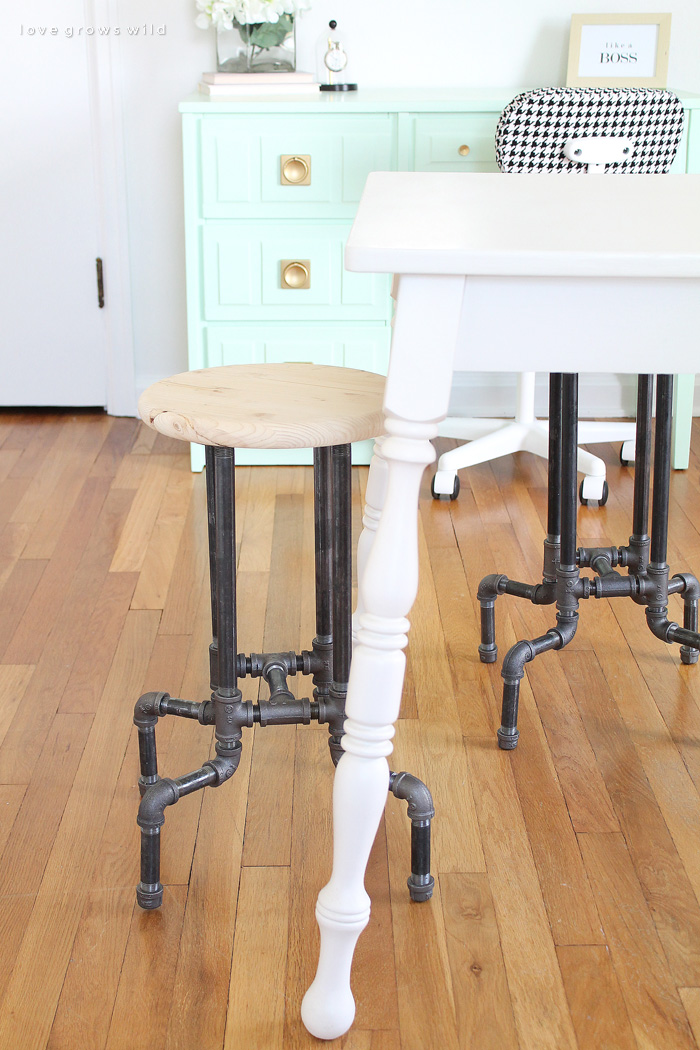 Learn how to make these awesome DIY Industrial Pipe Stools for your kitchen or office with no tools required! Click for details at LoveGrowsWild.com