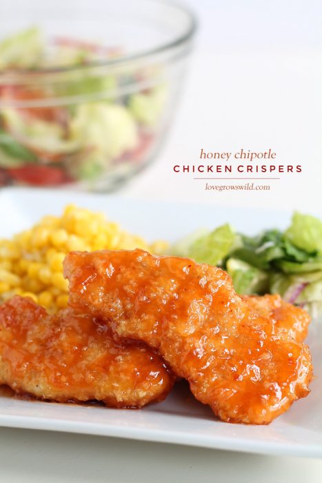 Easy baked chicken tenders smothered in a sweet, tangy honey chipotle sauce! Simply delicious! | LoveGrowsWild.com