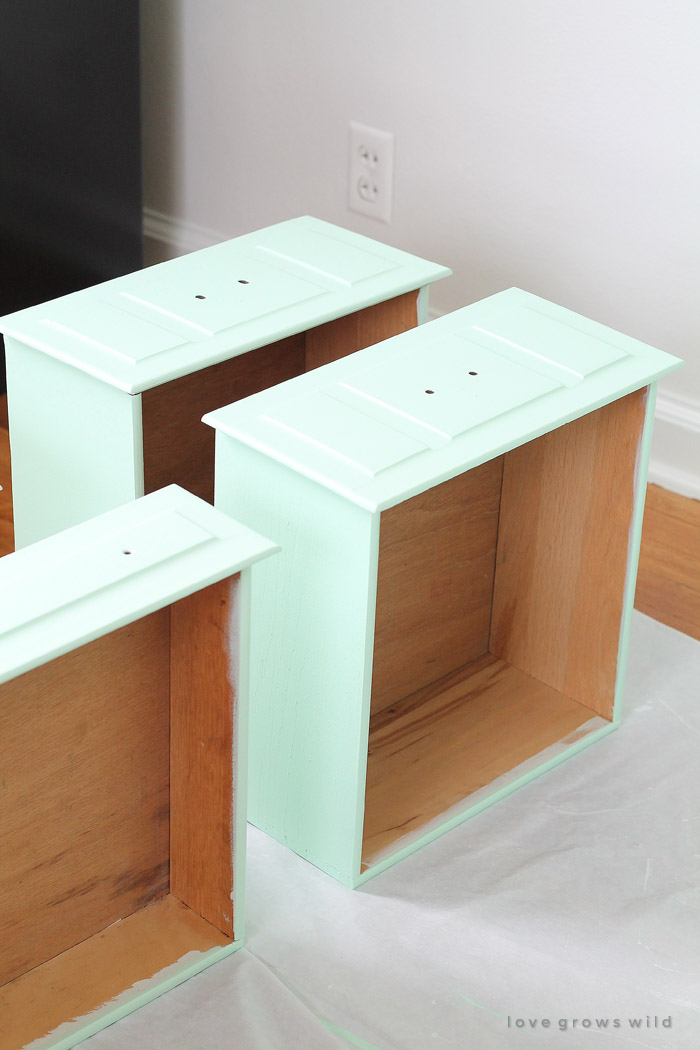 Come see how this old wood desk got a fun mint-colored makeover! Click for details at LoveGrowsWild.com