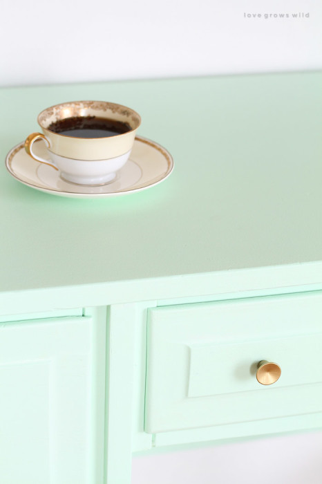 Come see how this old wood desk got a fun mint-colored makeover! Click for details at LoveGrowsWild.com
