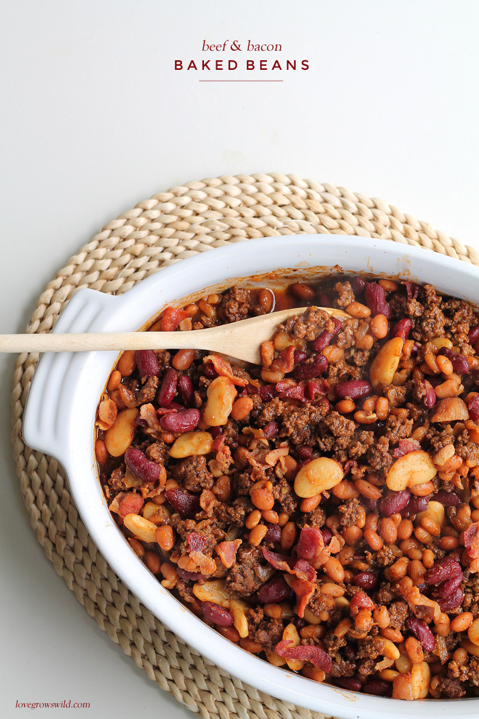 Perfect baked beans made extra meaty with ground beef and bacon! Full of flavor, easy to make, and a great side for parties, cookouts, or tailgating! | LoveGrowsWild.com