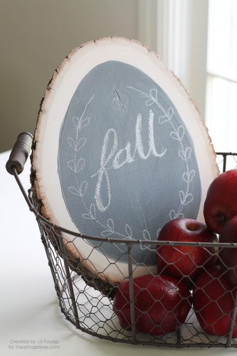 Make a simple chalkboard using a rustic wood round and some chalkboard paint! Details at LoveGrowsWild.com