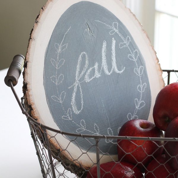 Make a simple chalkboard using a rustic wood round and some chalkboard paint! Details at LoveGrowsWild.com