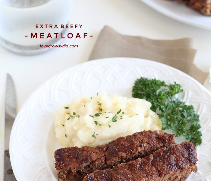 This easy meatloaf recipe is extra beefy with the addition of one delicious secret ingredient! Find out how to make the best meatloaf you have ever eaten! | LoveGrowsWild.com
