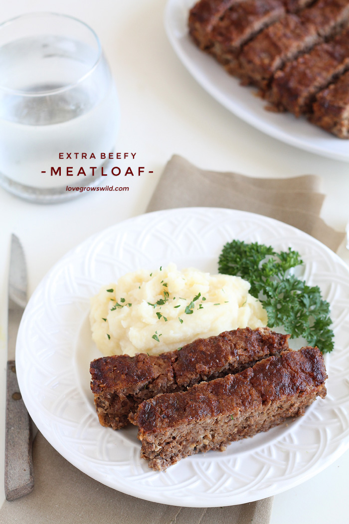 This easy meatloaf recipe is extra beefy with the addition of one delicious secret ingredient! Find out how to make the best meatloaf you have ever eaten! | LoveGrowsWild.com