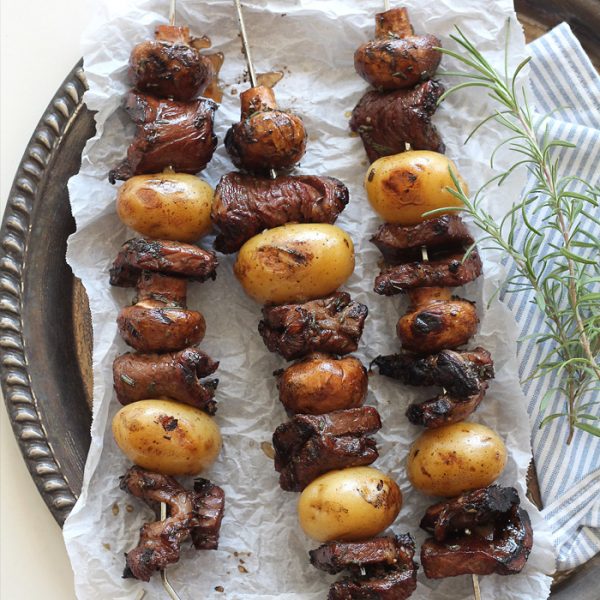 Steak, potato, and mushroom kabobs are soaked in a flavorful balsamic rosemary marinade and grilled to perfection! This takes steak and potatoes to a whole new level! | LoveGrowsWild.com