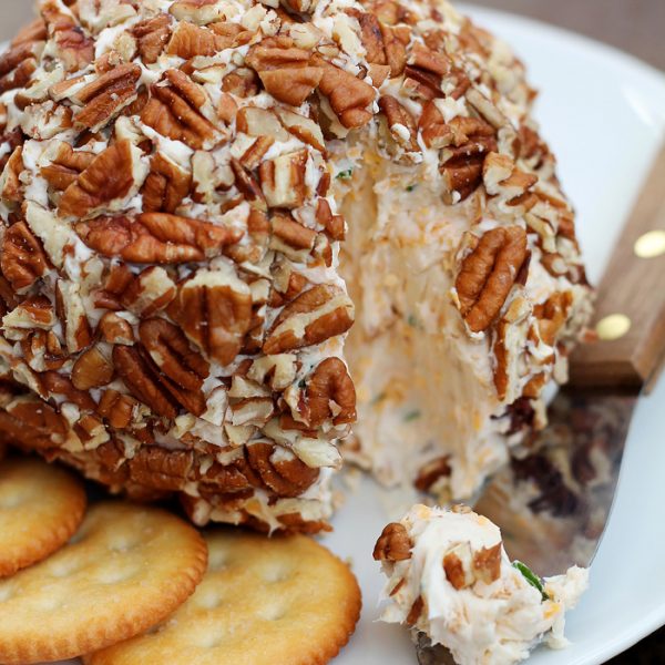 This Bacon Cheddar Cheese Ball is always a party favorite! Super creamy, loaded with bacon, and wrapped in pecans for a delicious and easy appetizer! | LoveGrowsWild.com