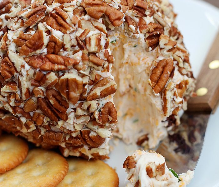 This Bacon Cheddar Cheese Ball is always a party favorite! Super creamy, loaded with bacon, and wrapped in pecans for a delicious and easy appetizer! | LoveGrowsWild.com