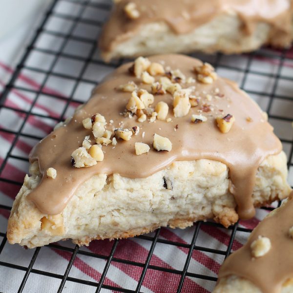Tender, buttery scones with chopped walnuts and a decadent maple glaze - the perfect treat with your morning coffee! | LoveGrowsWild.com