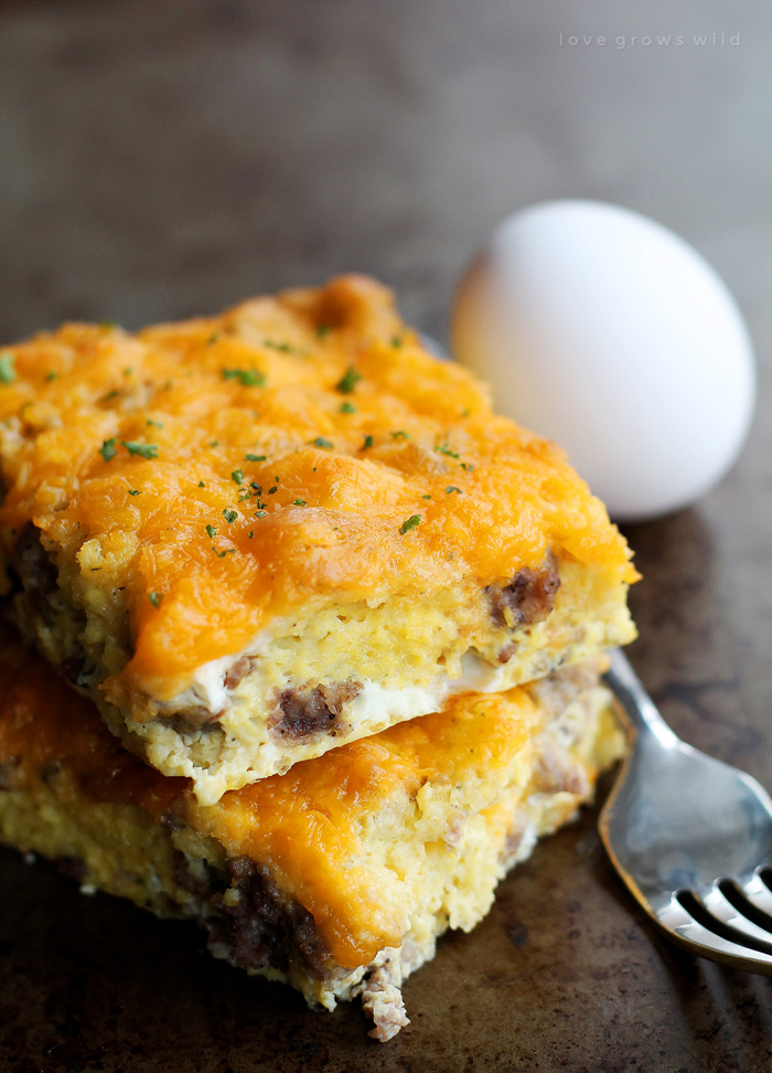 This easy overnight egg casserole is loaded with breakfast sausage and topped with tons of cheddar cheese. Chill overnight then bake in the morning for a delicious, hearty breakfast! | LoveGrowsWild.com