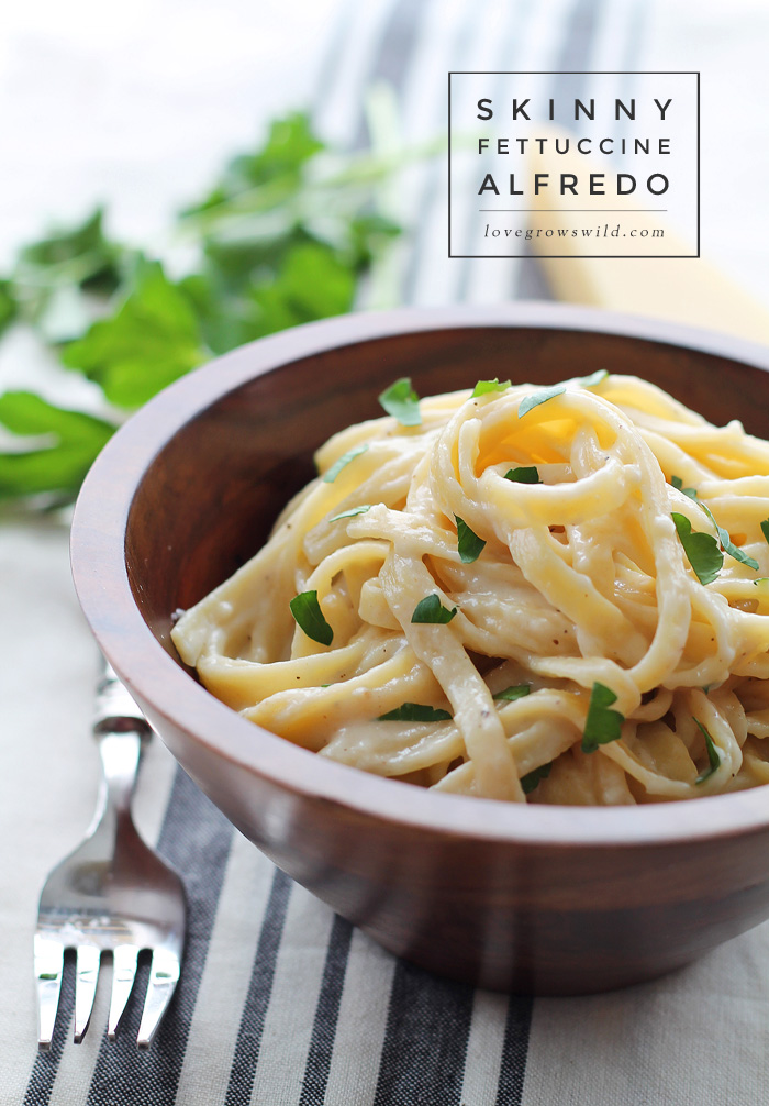 Skinny Fettuccine Alfredo - creamy, cheesy pasta that is light on calories but big on flavor! Get the recipe at LoveGrowsWild.com