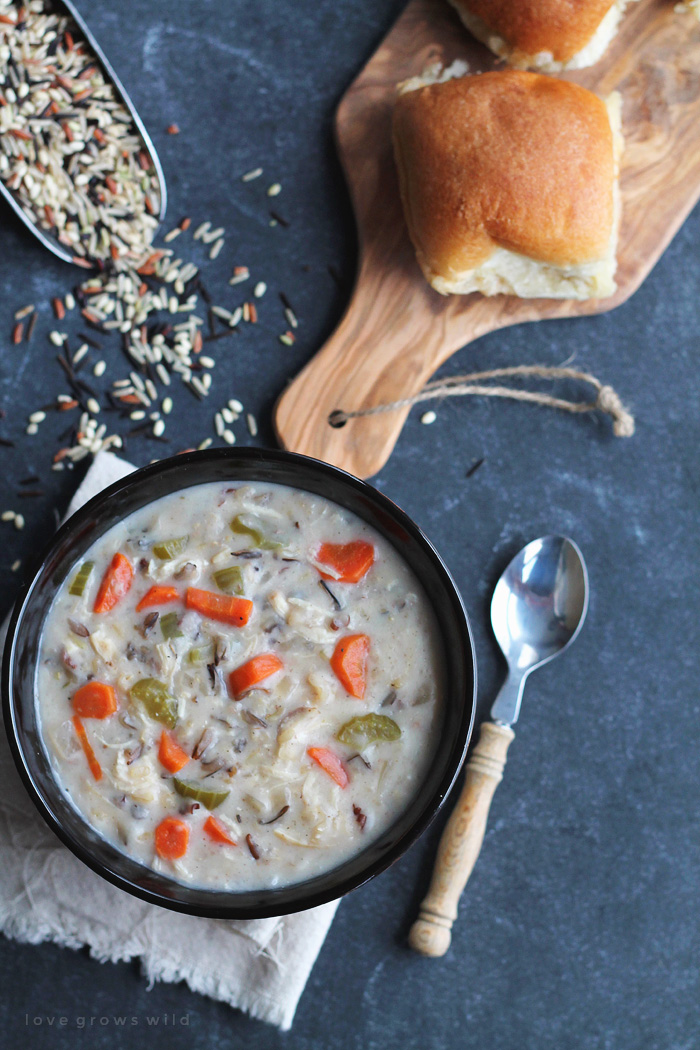 Chicken Wild Rice Soup made in the slow cooker! Creamy, flavorful, and so simple! Get the recipe at LoveGrowsWild.com