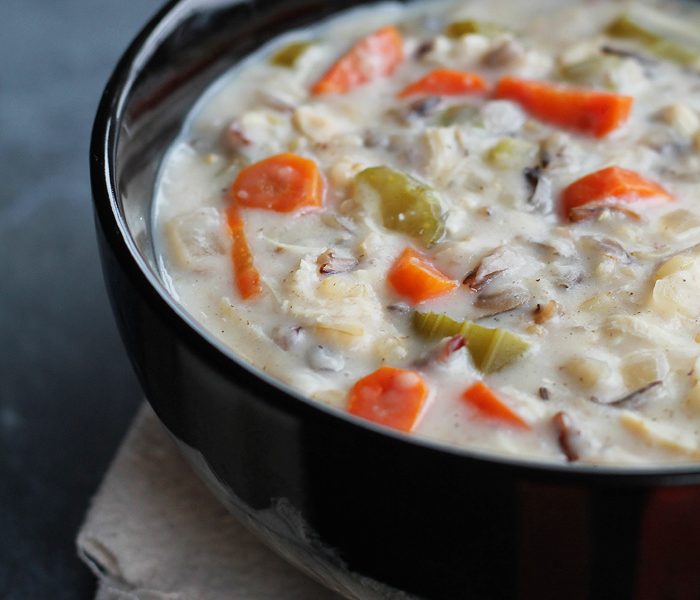 Chicken Wild Rice Soup made in the slow cooker! Creamy, flavorful, and so simple! Get the recipe at LoveGrowsWild.com