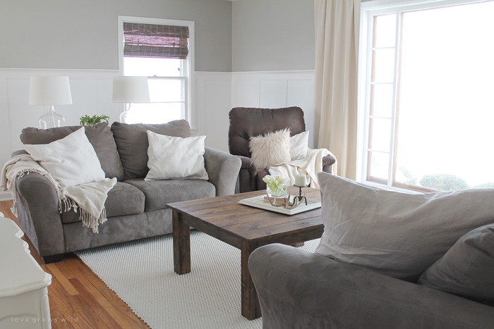 This living room is light and bright, yet rustic and cozy at the same time. Come see the transformation of this beautiful farmhouse living room! Click for more photos at LoveGrowsWild.com