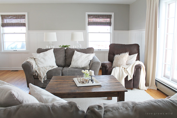 This living room is light and bright, yet rustic and cozy at the same time. Come see the transformation of this beautiful farmhouse living room! Click for more photos at LoveGrowsWild.com