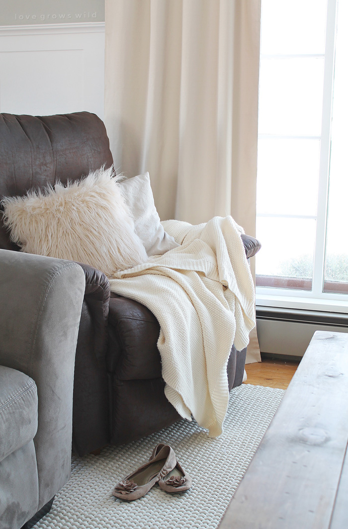 This living room is light and bright, yet rustic and cozy at the same time. Come see the transformation of this beautiful farmhouse living room! Click for more photos at LoveGrowsWild.com