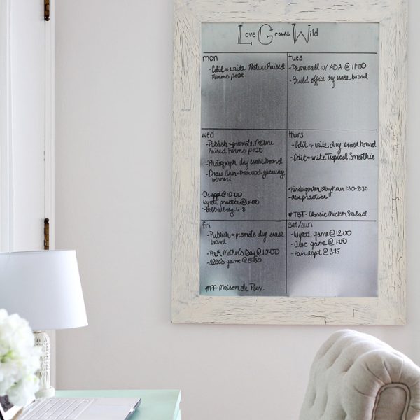 Get organized with this DIY Framed Dry Erase Board! It's simple to make and magnetic too! Get the full tutorial at LoveGrowsWild.com