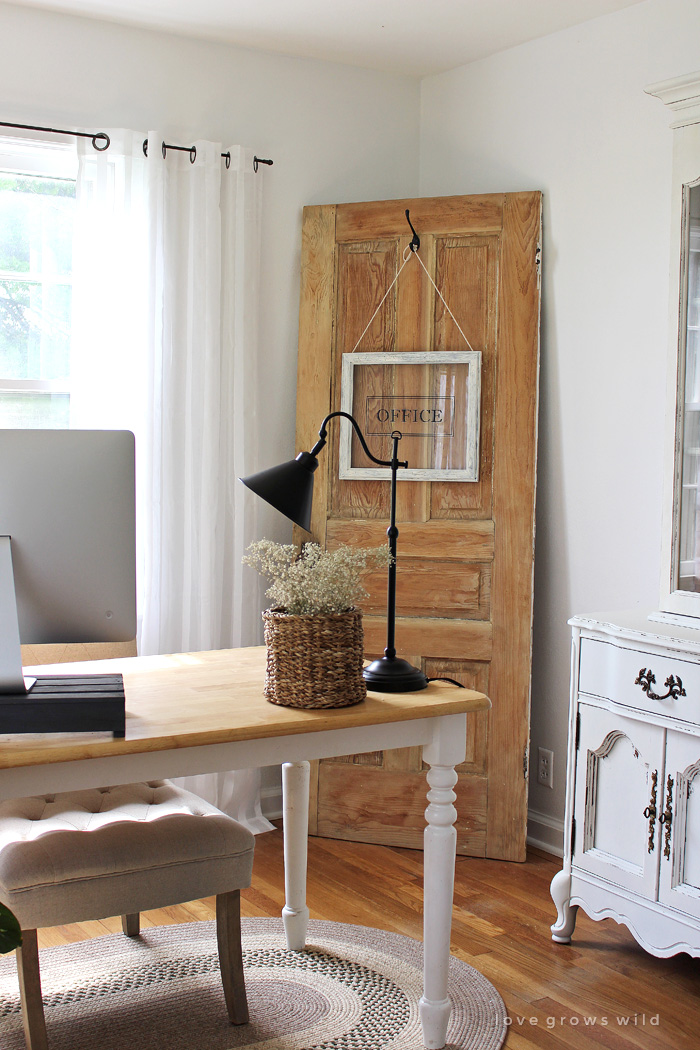 Turn any picture frame into a hanging sign! See more photos of this gorgeous farmhouse office decorated  with an old door at LoveGrowsWild.com