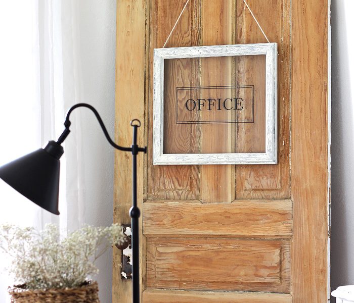 Turn any picture frame into a hanging sign! See more photos of this gorgeous farmhouse office decorated with an old door at LoveGrowsWild.com