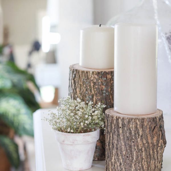 Bring a touch of nature into your home with these super easy (and cheap!) log candleholders. See more photos at LoveGrowsWild.com