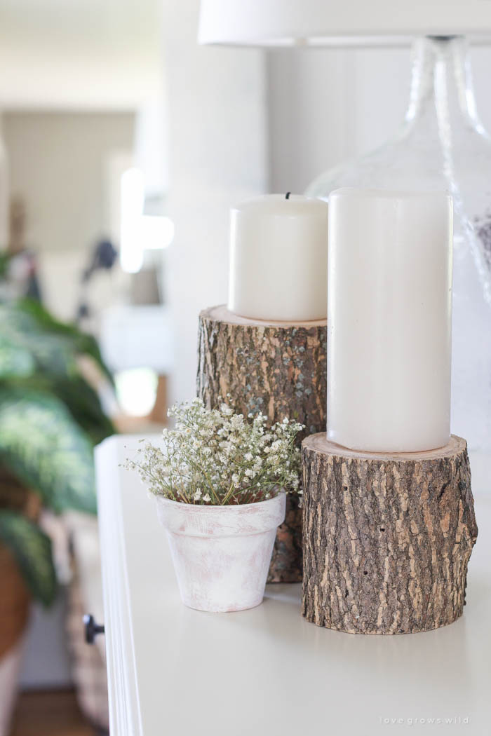 Bring a touch of nature into your home with these super easy (and cheap!) log candleholders. See more photos at LoveGrowsWild.com