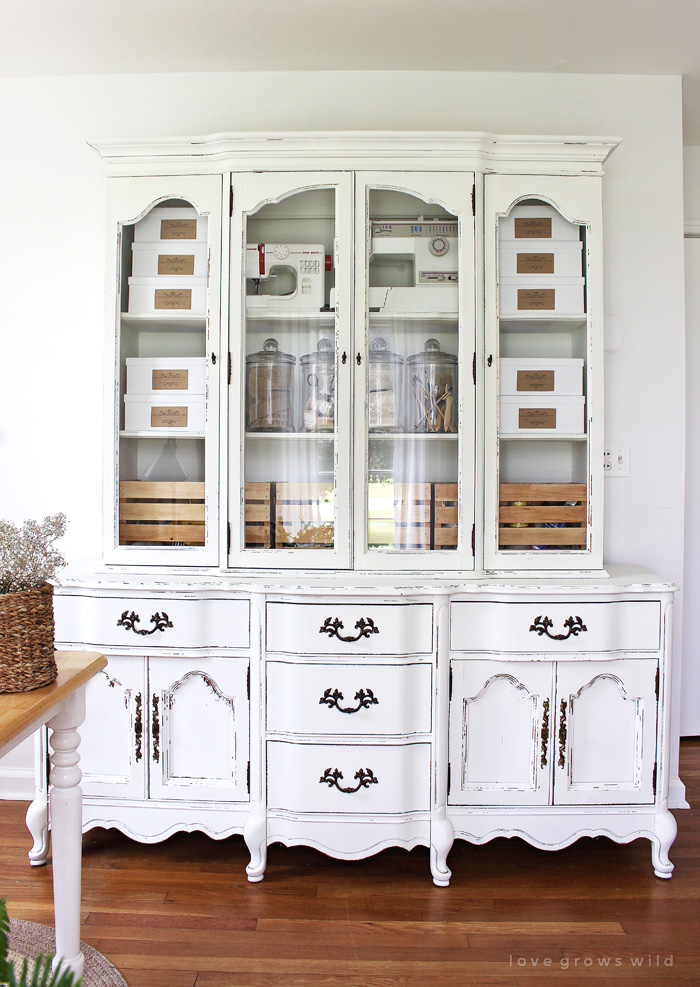 Old hutches and china cabinets make great storage for an office! See how this outdated piece gets transformed at LoveGrowsWild.com