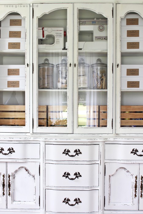 Old hutches and china cabinets make great storage for an office! See how this outdated piece gets transformed at LoveGrowsWild.com