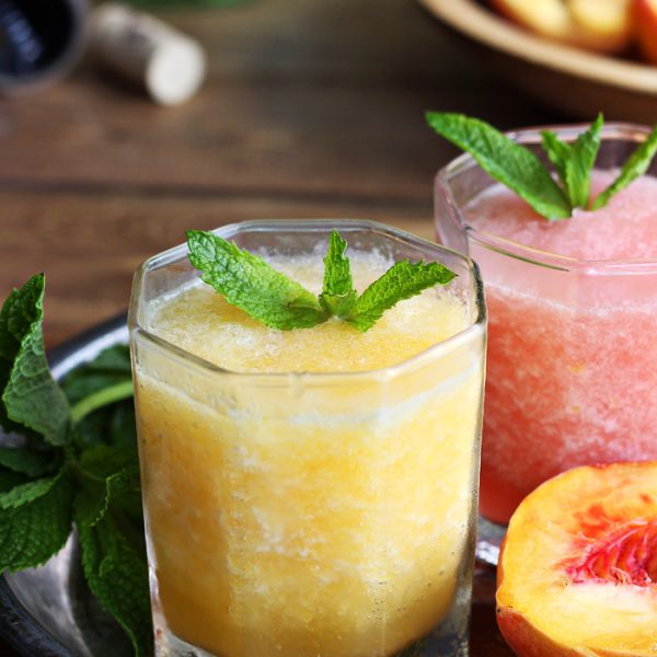 This wine slush is the perfect sip on a hot summer day! Just blend wine and fruit together and freeze into ice cubes, then enjoy a grown-up slushie whenever the mood strikes. | LoveGrowsWild.com