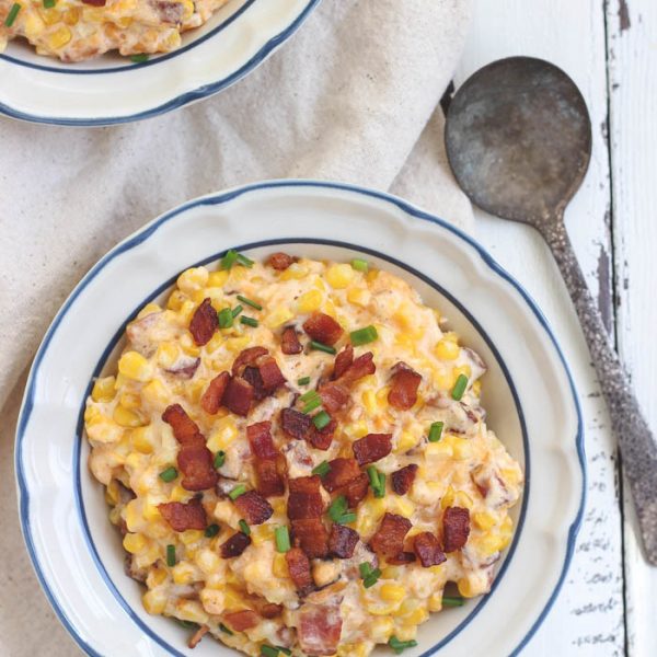 You must try this easy, mouthwatering side dish! Creamy, cheesy corn casserole hot out of the oven with tons of crispy bacon! | LoveGrowsWild.com