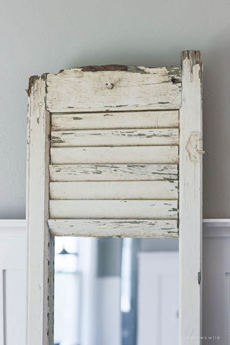 Learn how to take an old shutter and turn it into a beautiful mirror with tons of farmhouse charm! | LoveGrowsWild.com
