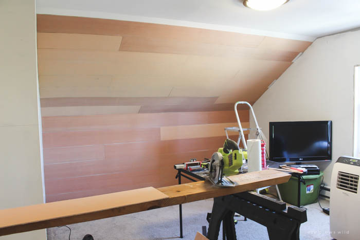 This master bedroom gets a dramatic makeover with beautiful white wide plank walls. Learn how to plank YOUR walls at LoveGrowsWild.com!