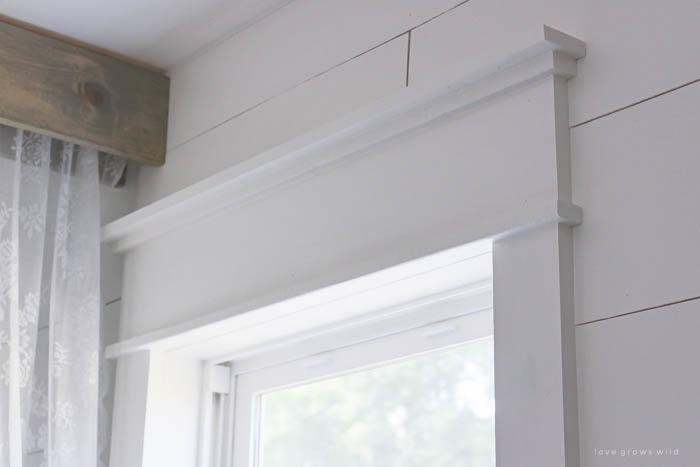 Learn how to bulk up the trim around your windows for a beautiful farmhouse look! Such an easy and inexpensive upgrade! | LoveGrowsWild.com
